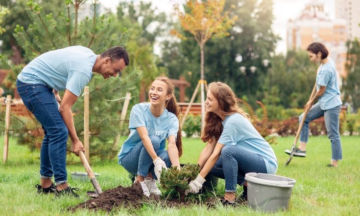 Children learning tree care during a school workshop